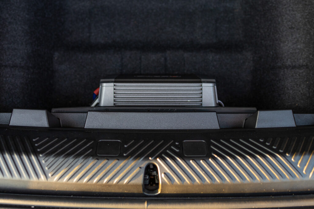 Hertz Amplifier in BMW i5 Trunk Storage Compartment